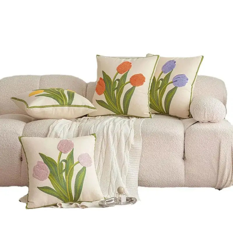 Cream-colored embroidered flower pillowcase cover with tulips in orange purple and pink on textured fabric for living room decor