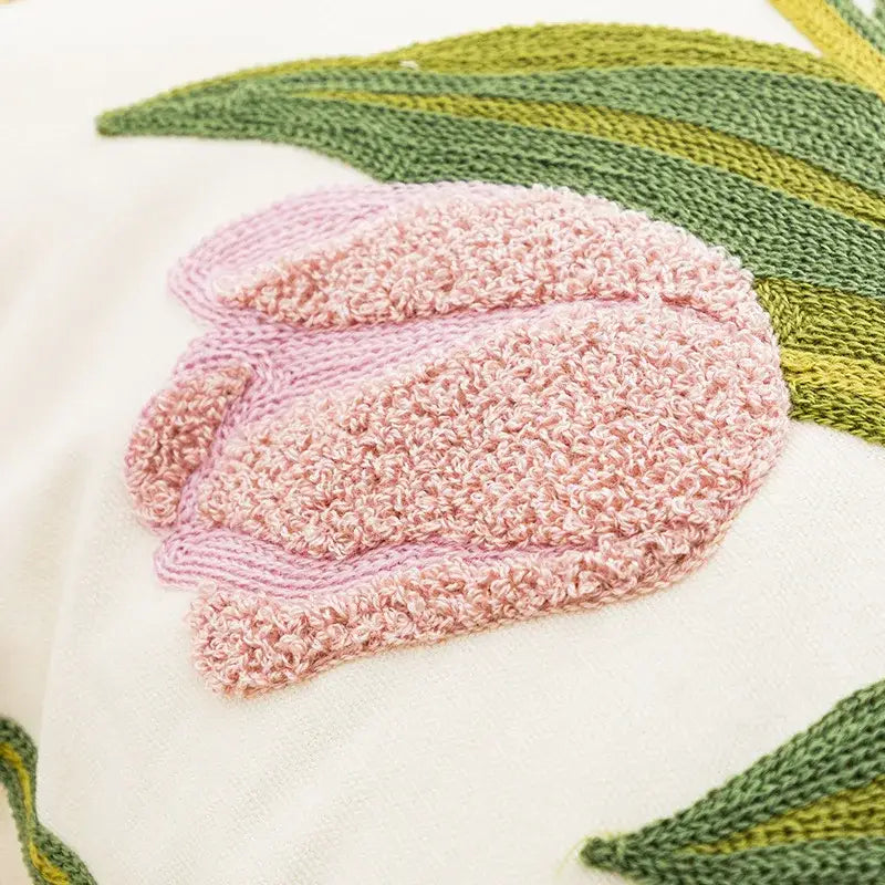 Embroidered flower pillowcase cover featuring a soft pink knitted tulip on cream fabric with green leaf accents for living room decor