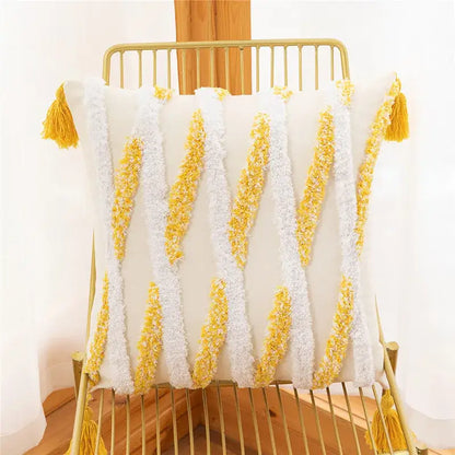 White and yellow embroidered geometric leaves pillow cover with textured fabric and tassels for living room decor