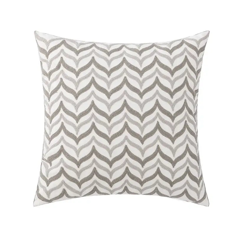 Square pillow cover with modern gray and white chevron embroidery suitable for living room decor with yellow floral accents
