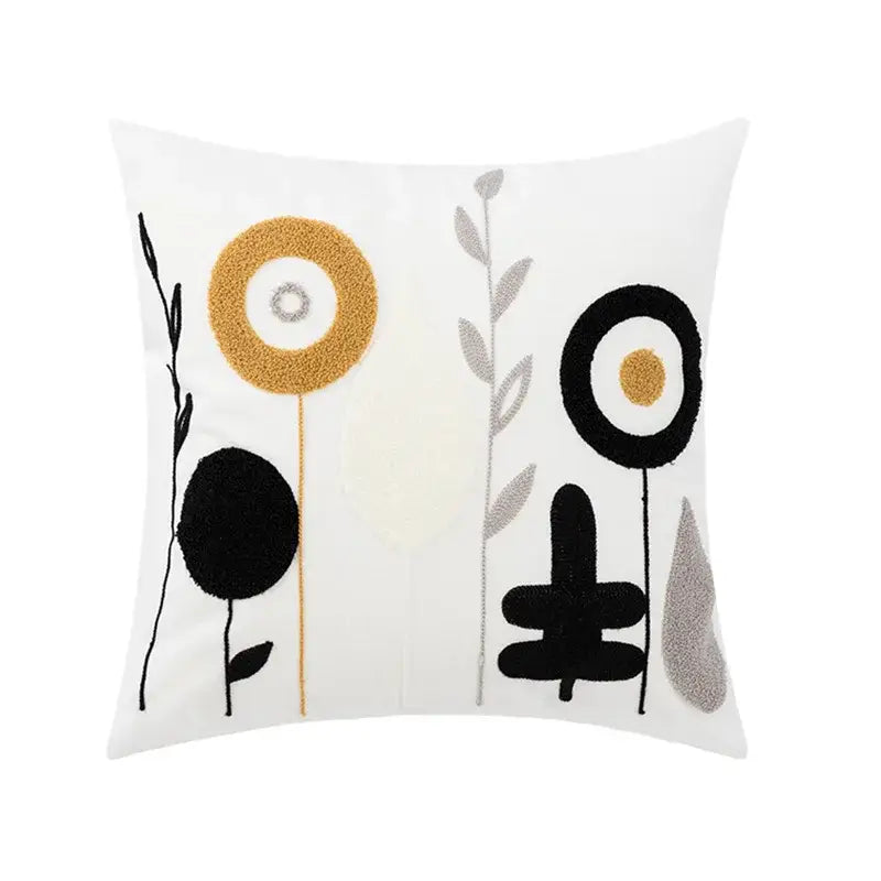 White throw pillow cover with abstract embroidered flowers in black gold and silver featuring textured yarn detailing for living room