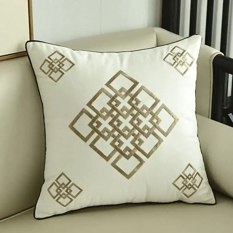 White square throw pillow with black piping and intricate gold geometric embroidery for embroidered horse pillowcase decor