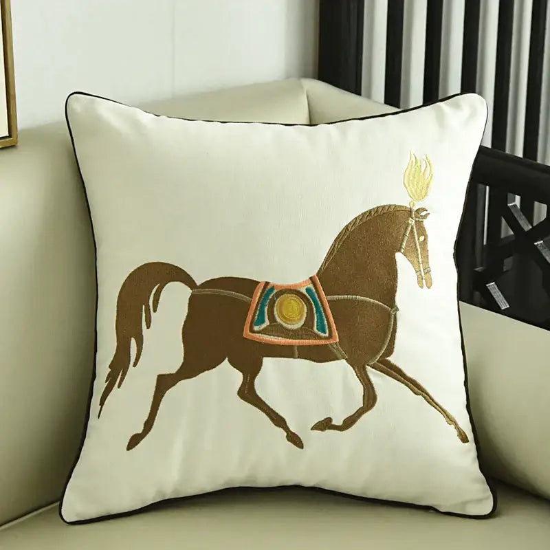 Cream-colored embroidered horse pillowcase with brown horse and golden flame detail for living room decor