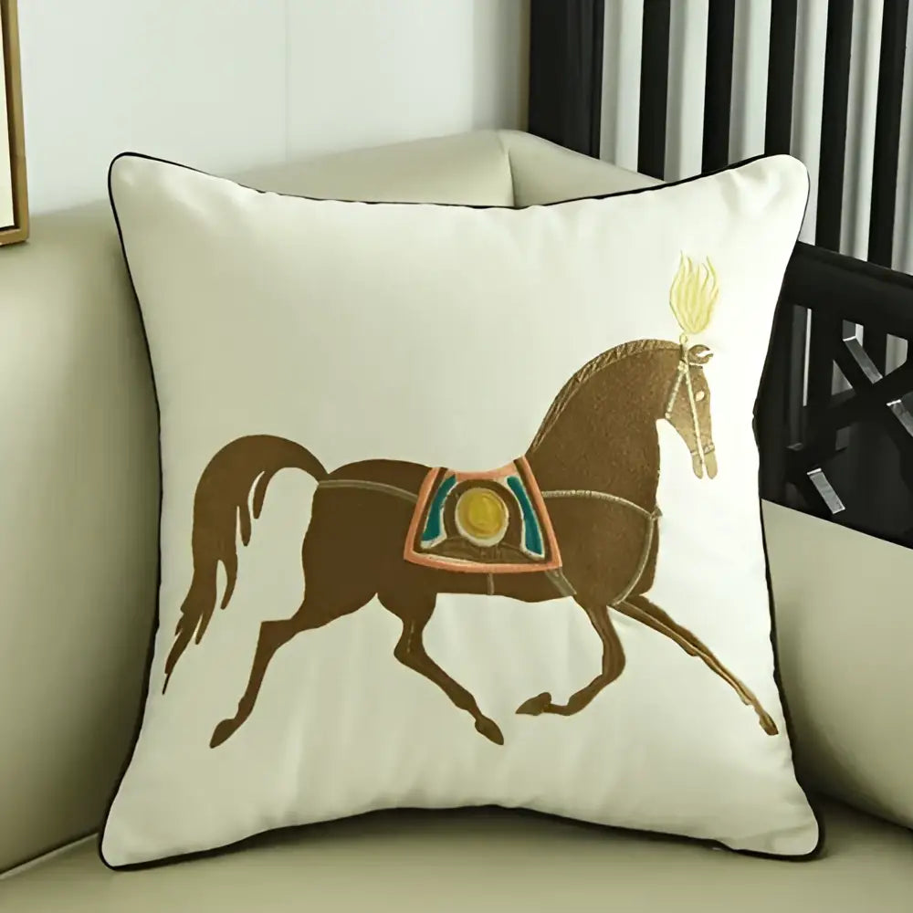 Cream-colored square throw pillow with embroidered horse pillowcase featuring brown horse and golden flame decor