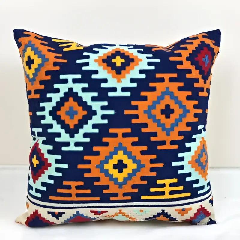 Vibrant embroidered kilim style cushion cover with navy orange and teal geometric woven design for living room