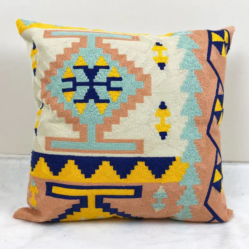 Square cushion cover with embroidered kilim style geometric design in cream peach turquoise and navy blue for living room