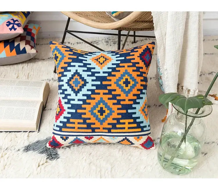 Vibrant embroidered kilim style cushion cover with navy orange light blue and red geometric pattern for living room