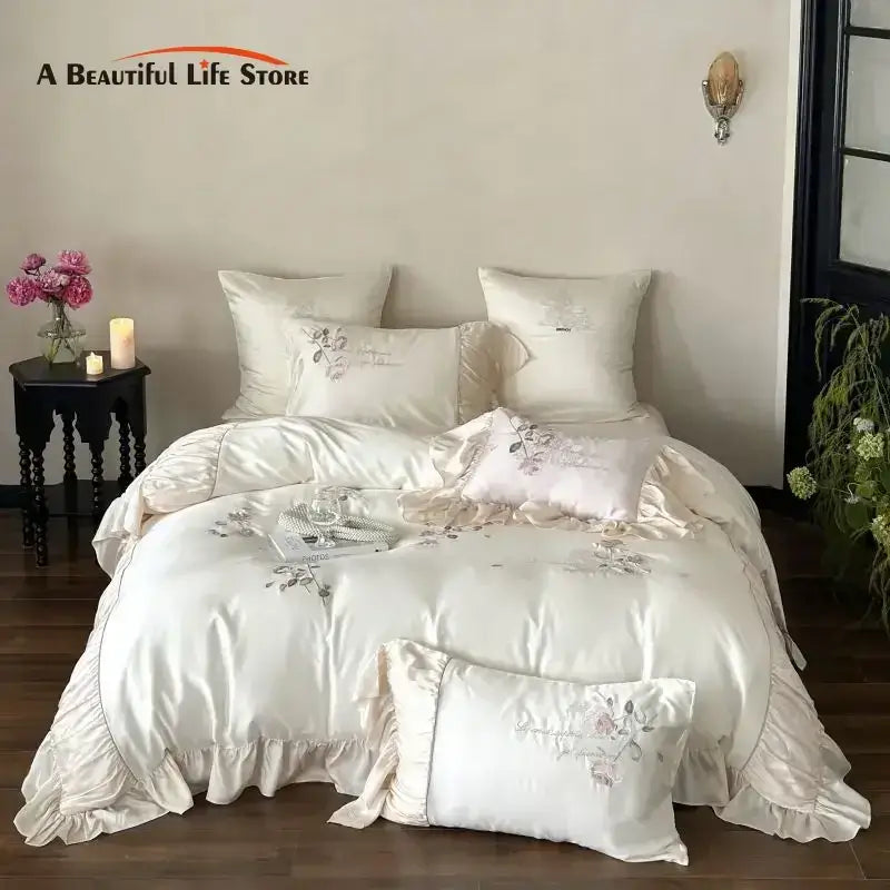 Cream-colored satin embroidered lace princess bedding set with floral embroidery and ruffled edges for bedroom decor