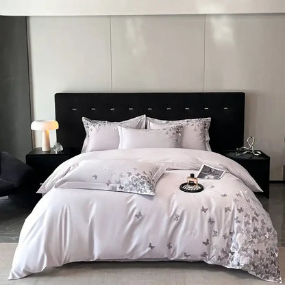 Elegant satin bedding set with silver butterflies embroidery on a soft white base for bedroom decorbites butterflies embroidery