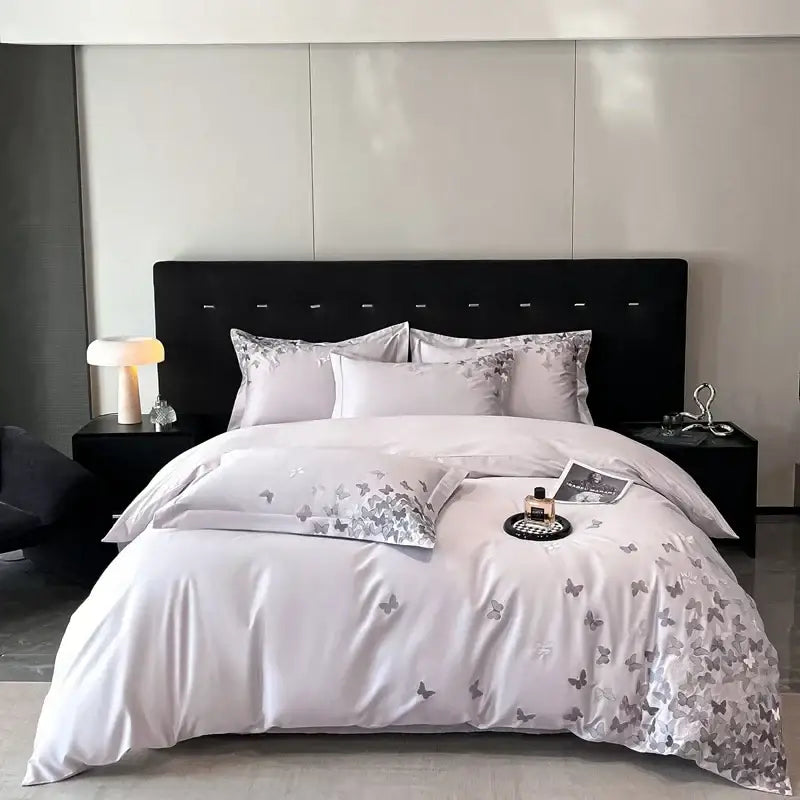 Elegant satin bedding set with silver butterflies embroidery on a soft white base for bedroom decorbites butterflies embroidery