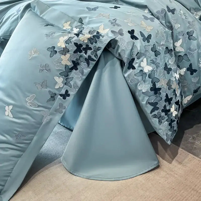 Light blue satin bedding set featuring intricate decorbites butterflies embroidery in black white and gray for bedroom decor