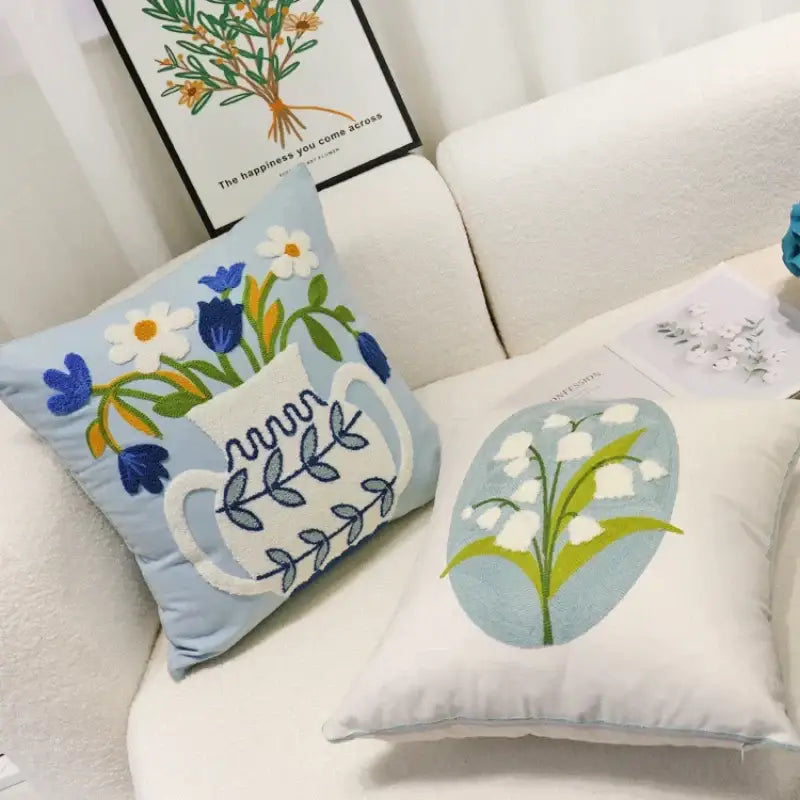 Light blue embroidered square pillowcase with white pitcher and colorful flowers in decorbites blue hyacinth style