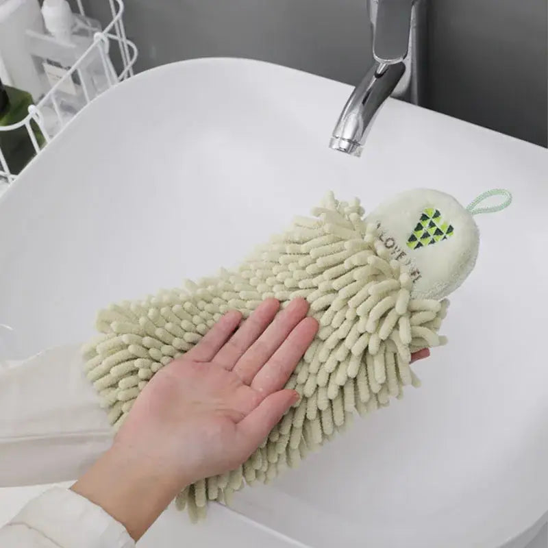 A soft off-white embroidered microfiber hand towel with green details for pale green and cream kitchen decor