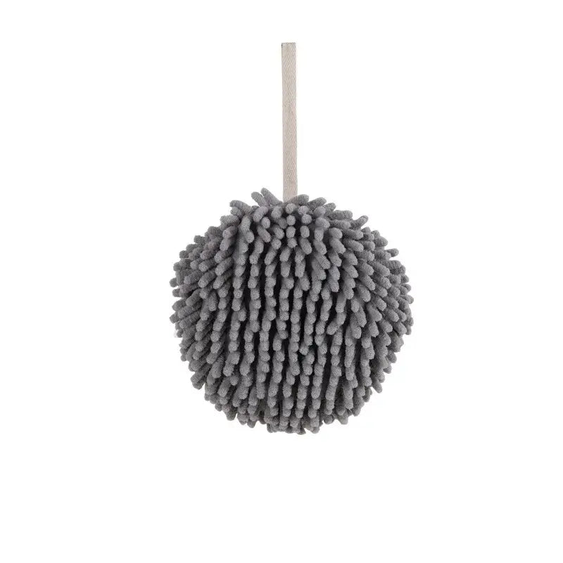 Gray spherical microfiber cleaning mitt with wooden handle paired with embroidered microfiber hand towel pale green cream