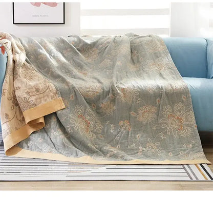 Embroidered sage green cotton gauze summer quilt with floral embroidery and tan border decorbites cotton gauze