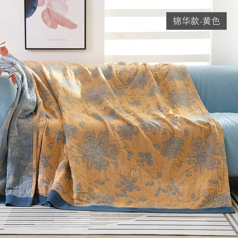 Embroidered mustard and navy cotton gauze summer quilt with yellow floral pattern and soft textured fabric decorbites cotton gauze