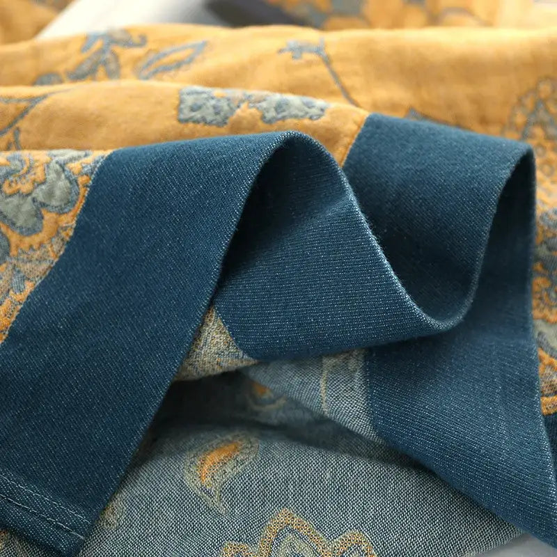 Embroidered mustard and navy cotton gauze summer quilt with textured fabric and blue floral decorbites cotton gauze design