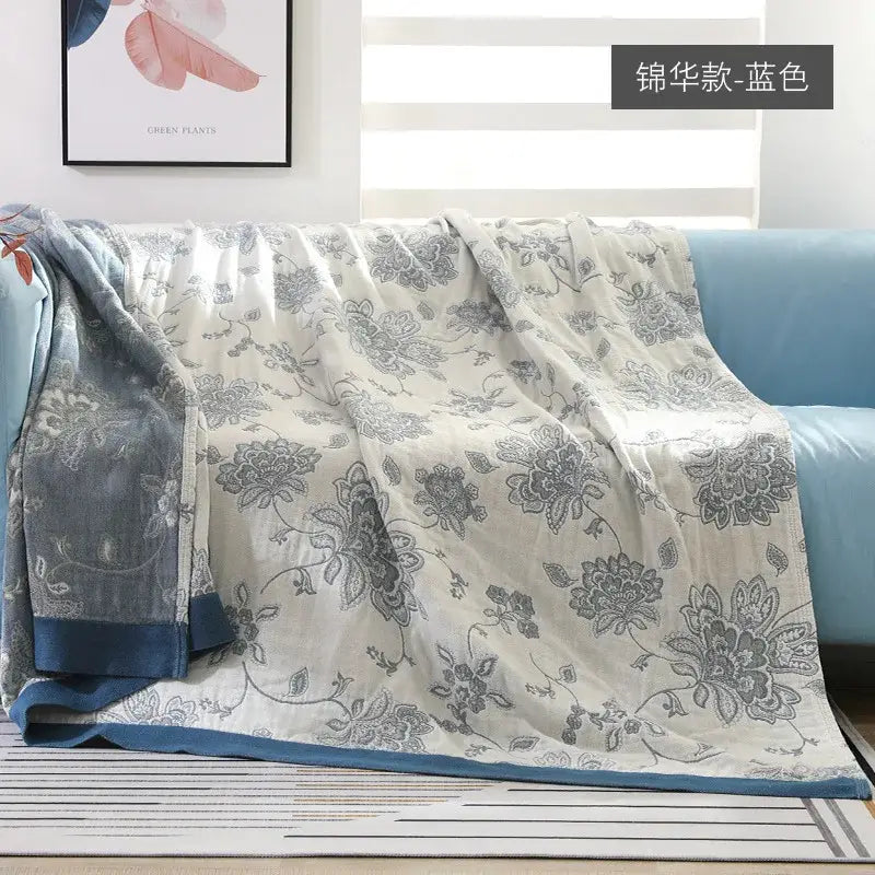 A cream-colored cotton gauze summer quilt with gray floral embroidery and blue border for decorbites cotton gauze bedding