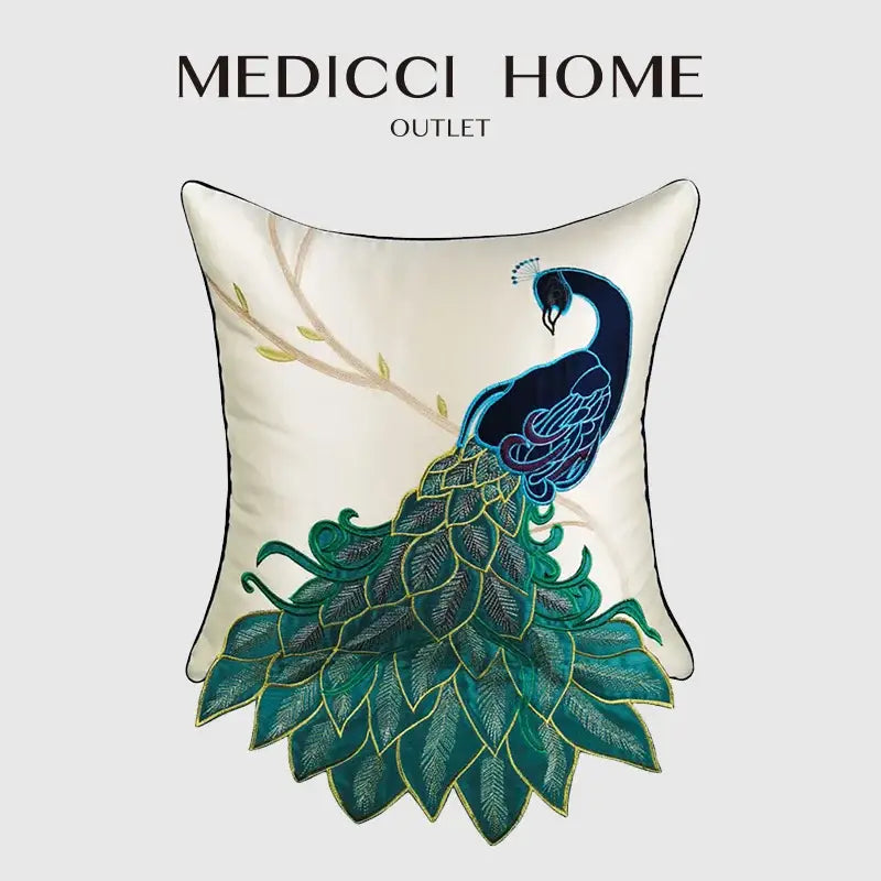 Cream satin cushion cover with an embroidered peacock design in deep blue teal green and gold thread for living room