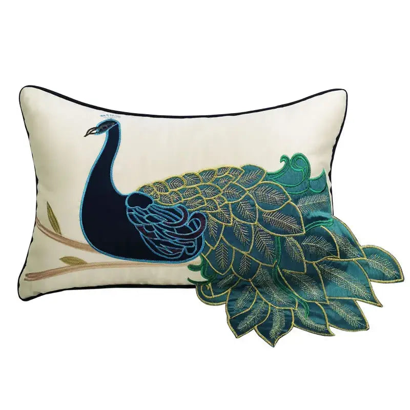 Cream satin cushion cover with embroidered peacock design in navy blue teal and gold for living room decor