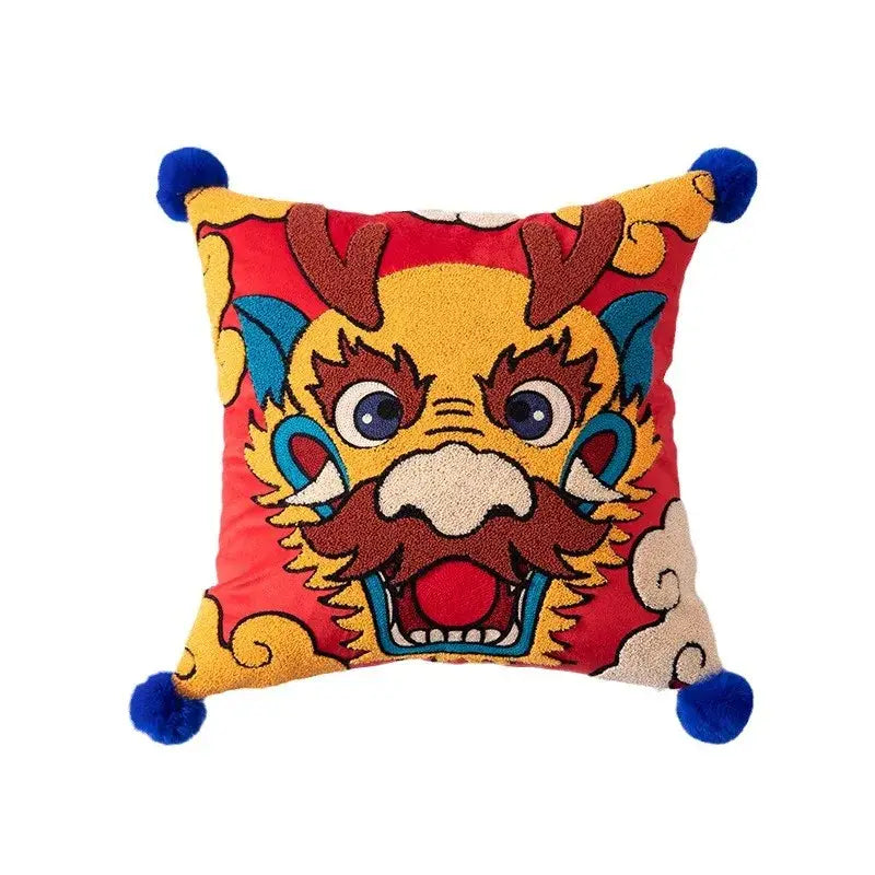 Vibrant red cushion cover featuring embroidered chinese dragon face with blue pom-poms decorbites dragon year decor