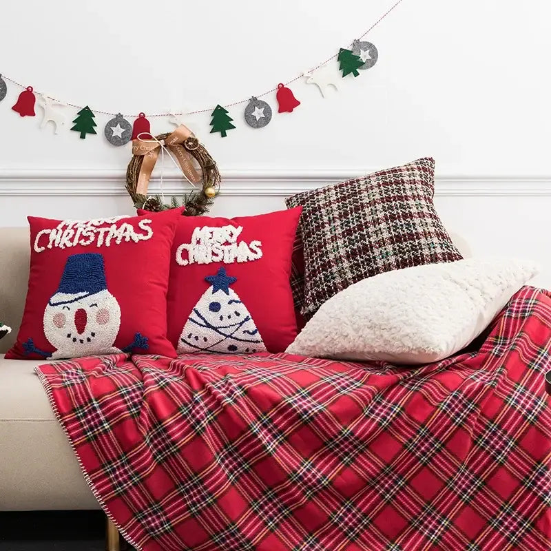 Embroidered red snowman cartoon christmas pillow covers with white lettering and blue accents on plush fabric decorbites cartoon christmas pillow decor