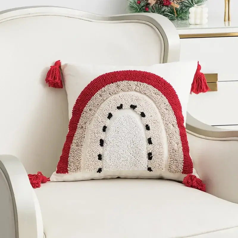 A cozy white pillow cover with textured red beige rainbow, black dots, and red tassels for decorbites cartoon christmas decor