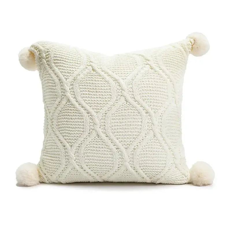Cream-colored knitted throw pillow with diamond cable stitching and pom-poms for decorbites cartoon christmas pillow covers