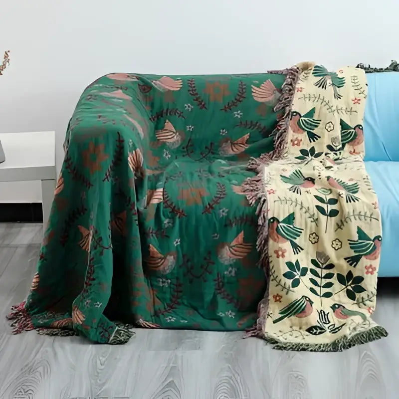Embroidered teal and cream cotton sofa throw blanket with green bird and floral motifs for living room use