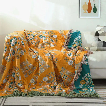 Vibrant orange and teal floral cotton sofa throw blanket with fringed edges for living room decor and comfort