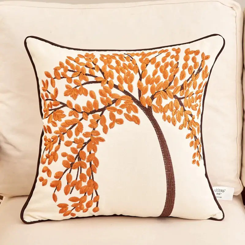 Cream-colored embroidered cushion cover featuring an autumn tree with orange leaves and a dark border for living room sofa