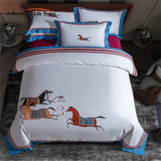 Embroidered white bedding set featuring vibrant galloping horses with blue trim for decorbites galloping horse decor