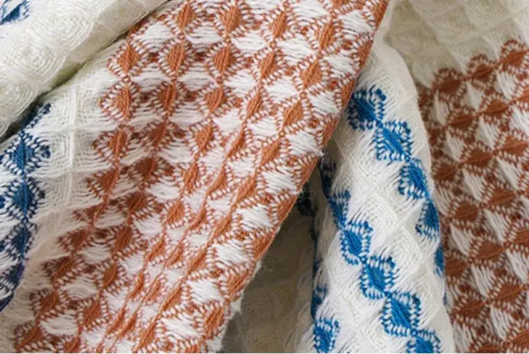 Embroidered white and blue cotton bath towel with intricate orange and blue patterns for bathroom decorbites cotton bath use