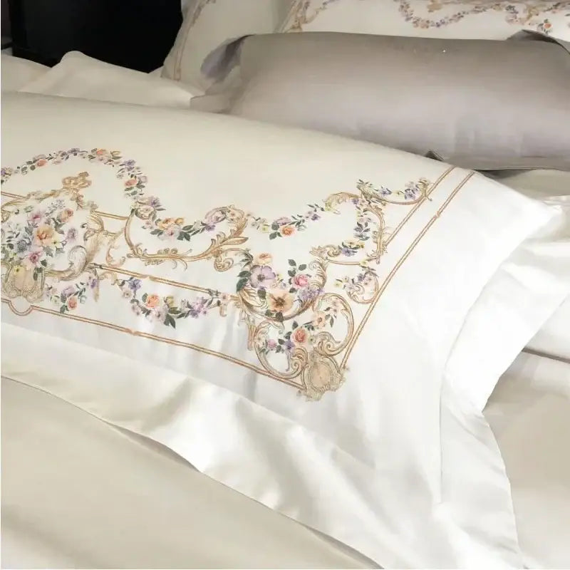 White satin pillowcase with gold embroidery in pastel hues from embroidered white egyptian cotton bedding set