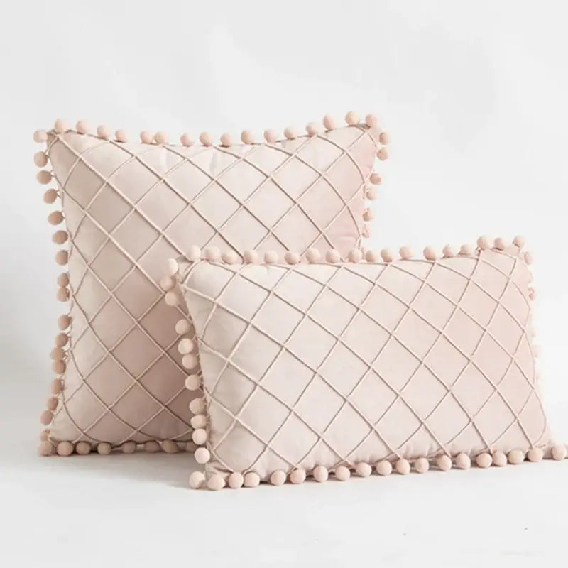Blush pink velvet pillows with diamond quilted pattern and pom pom trim in decorbites corduroy striped pompom pillowcase