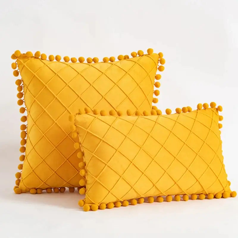 Vibrant yellow velvet throw pillows with diamond-quilted pattern and pom-pom trim for decorbites corduroy striped pillowcase