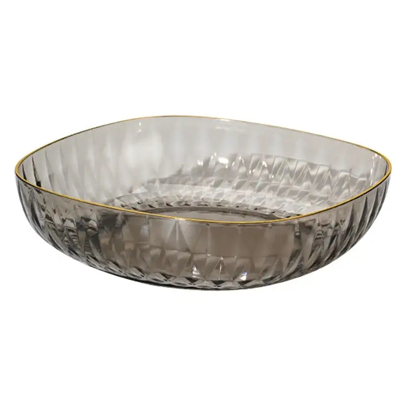 A sleek smoked glass crystal fruit plate with a geometric design and delicate gold rim for decorbites display