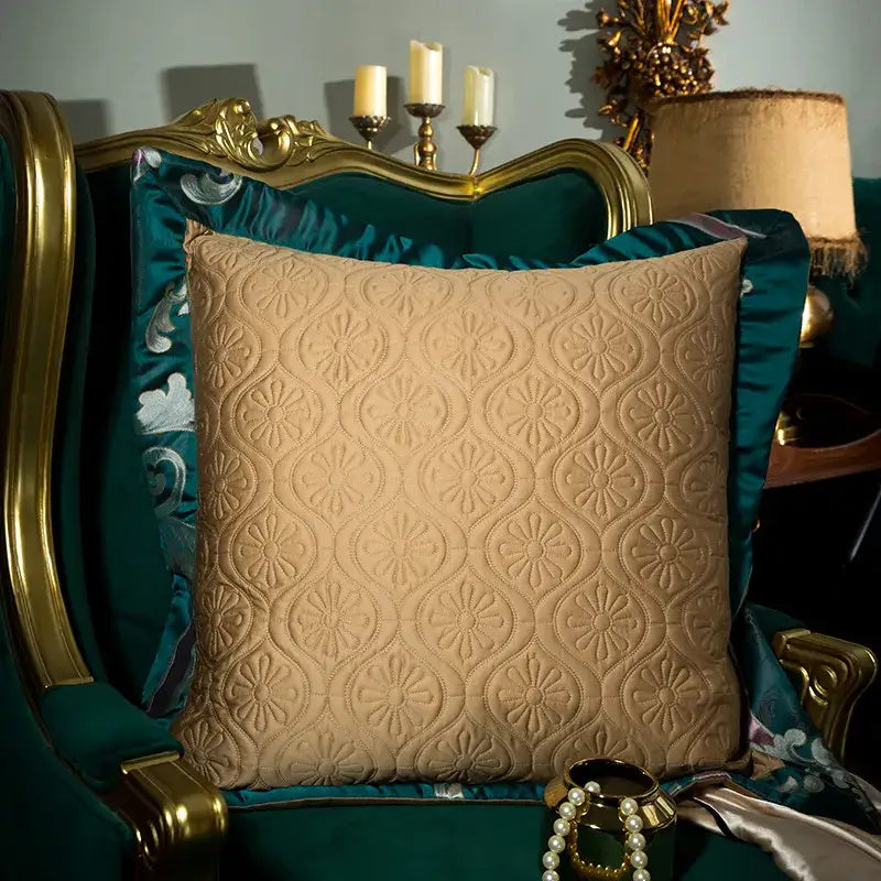 Beige quilted cushion with floral pattern on ornate green velvet chair in emerald green damask 200s embroidery egyptian cotton bedding set