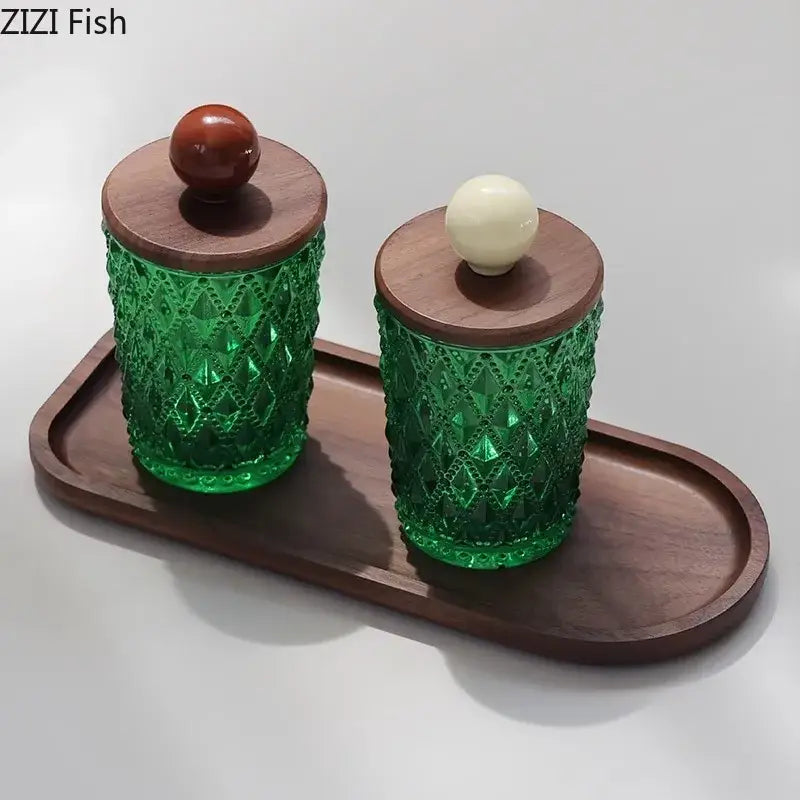 Pair of emerald green diamond glass storage jars with walnut lids and decorbites ceramic ball knobs for kitchen decor