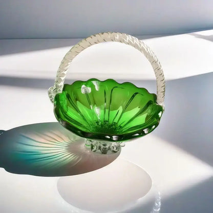 Emerald green glass fruit basket with decorbites crystal handle and scalloped edges on reflective glass tray