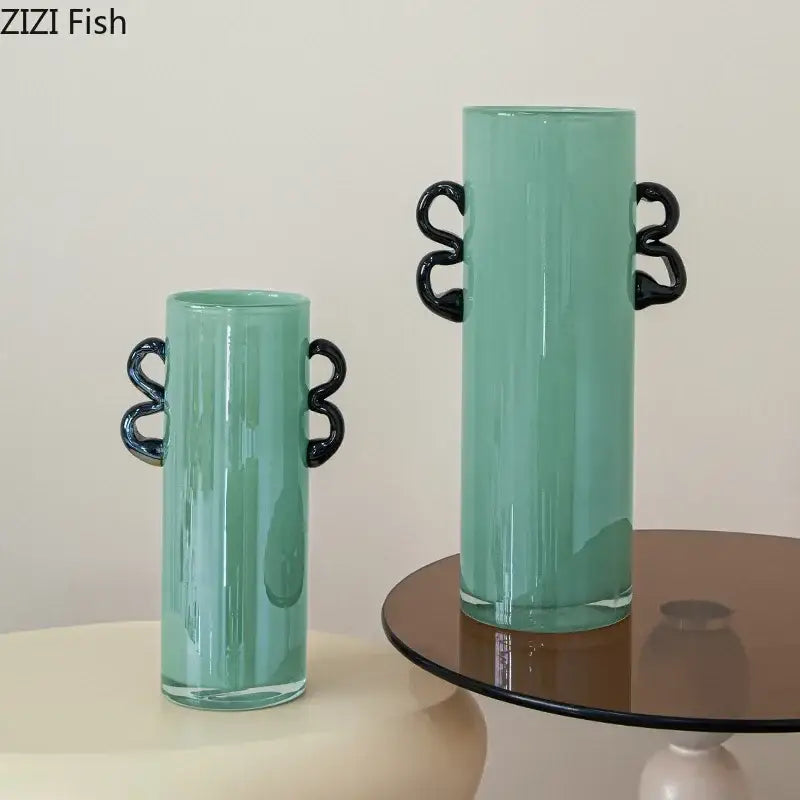 Emerald green glass vase with black twisted handle accents suitable for living room decor display