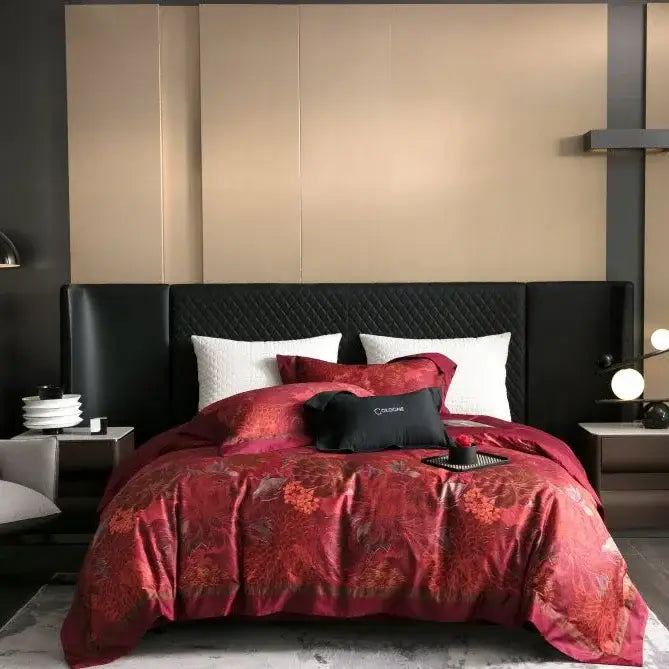 Red floral-patterned satin duvet set with black quilted headboard and white pillows in egyptian cotton bedding set