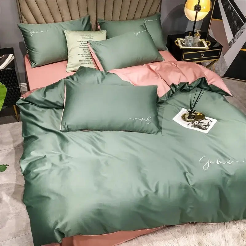 Emerald green and pink egyptian cotton bedding set with satin duvet cover featuring embroidered smmi branding