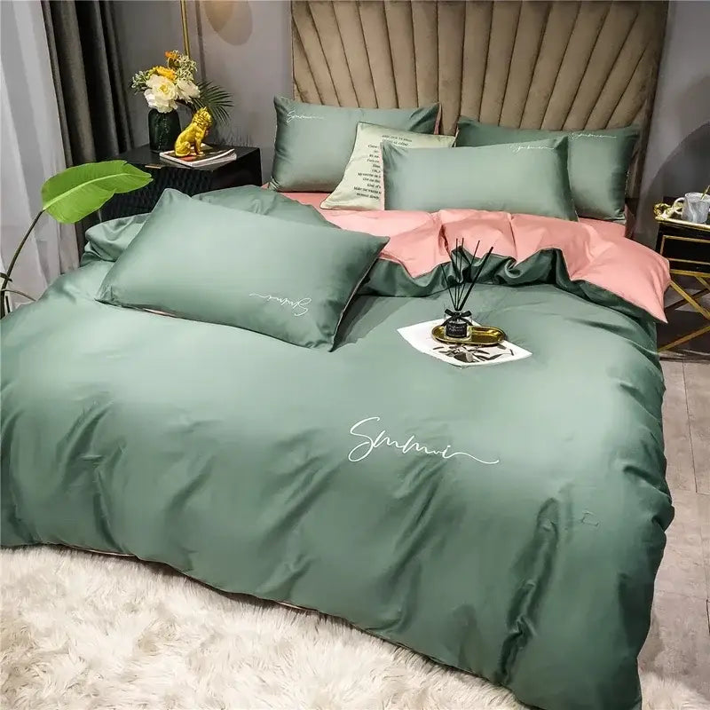 Emerald green satin duvet cover set with white cursive smami embroidery in egyptian cotton bedding set