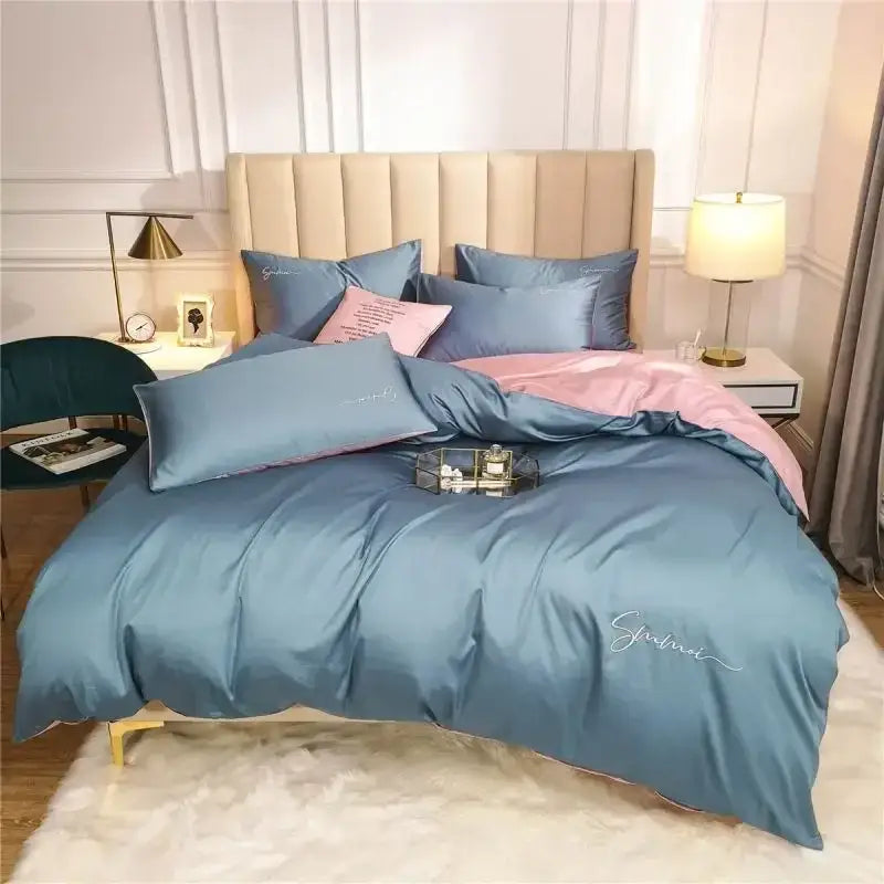 Emerald green and pink egyptian cotton bedding set with blue satin duvet cover and pink embroidered script detailing