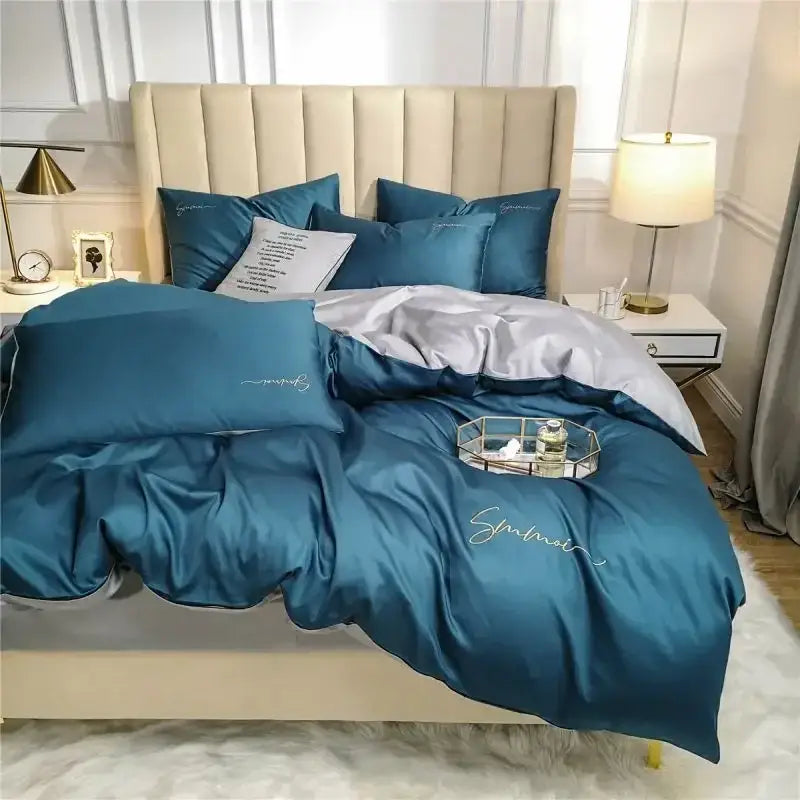 Teal satin duvet set with silver embroidery and matching pillow sham in emerald green and pink egyptian cotton bedding set
