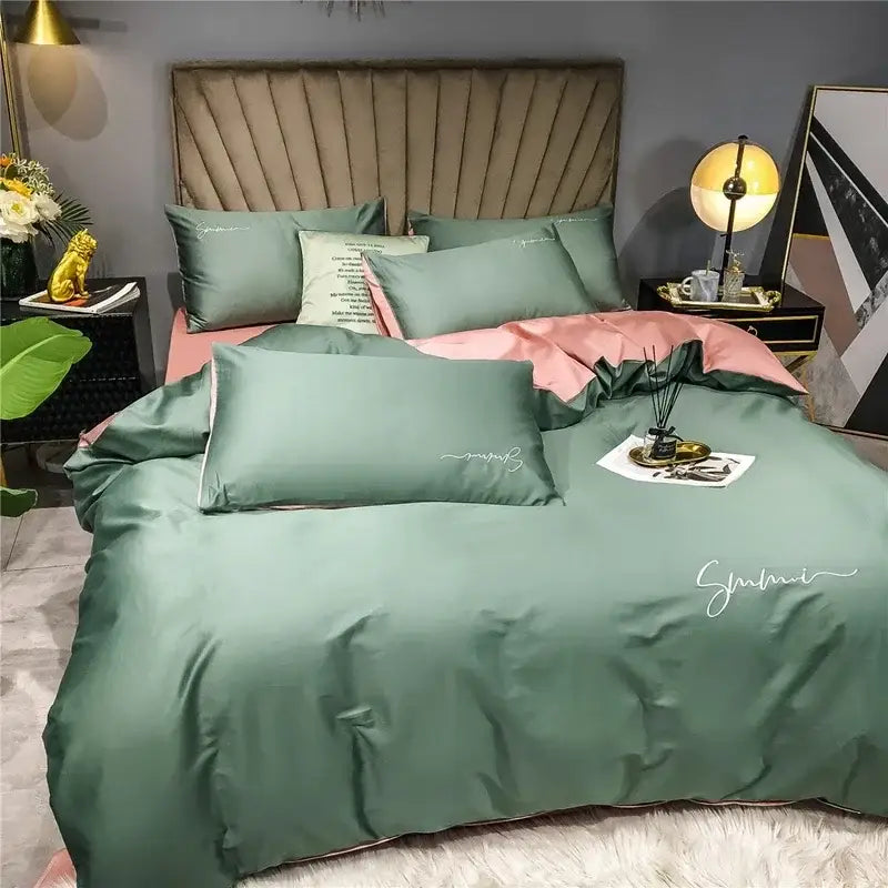 Emerald green satin duvet cover set with subtle white cursive embroidery in egyptian cotton bedding set for bedroom