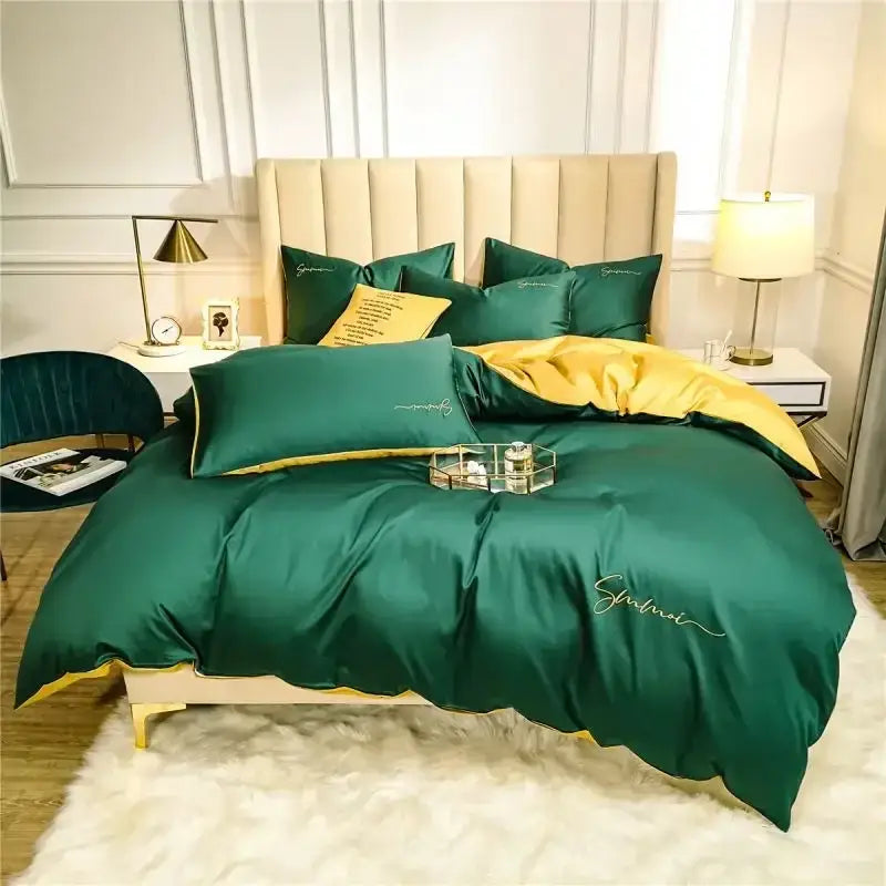 Emerald green satin duvet set with gold trim and embroidered script detailing in egyptian cotton bedding set