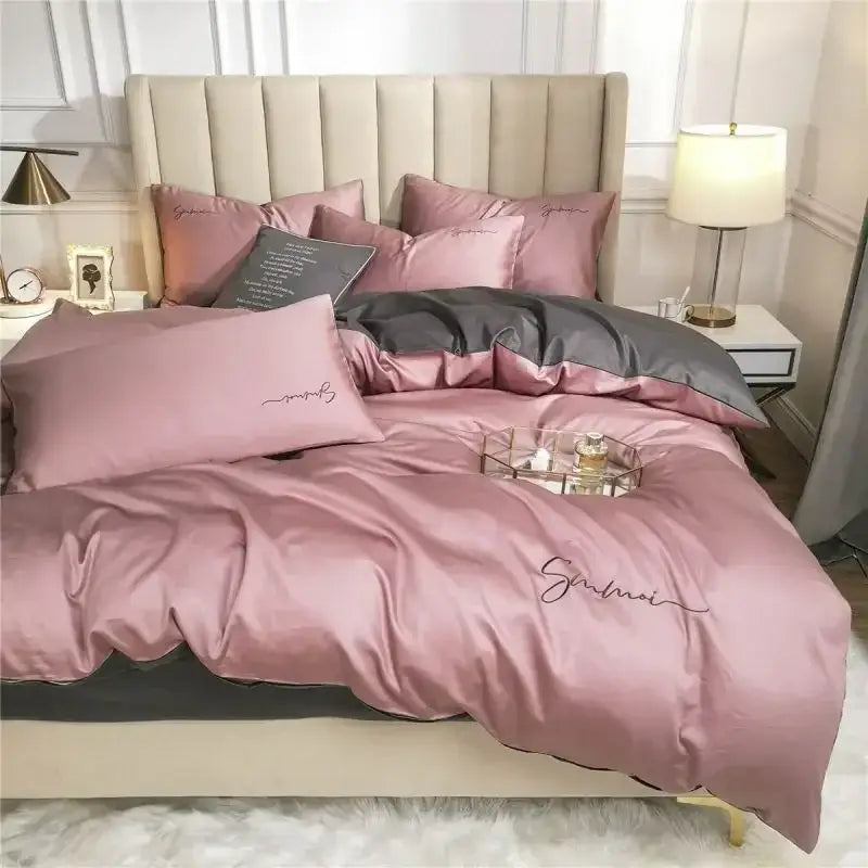 Emerald green and pink egyptian cotton bedding set featuring a pink satin duvet cover with dark gray accent and embroidery