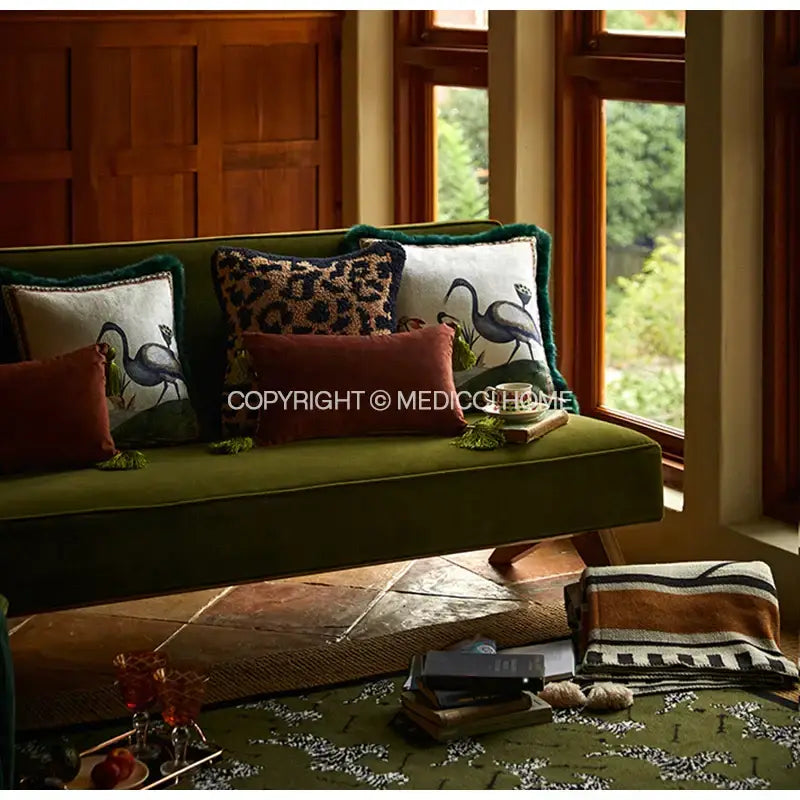 Emerald green velvet birds floral print cushion cover with decorbites birds floral design on olive green velvet sofa